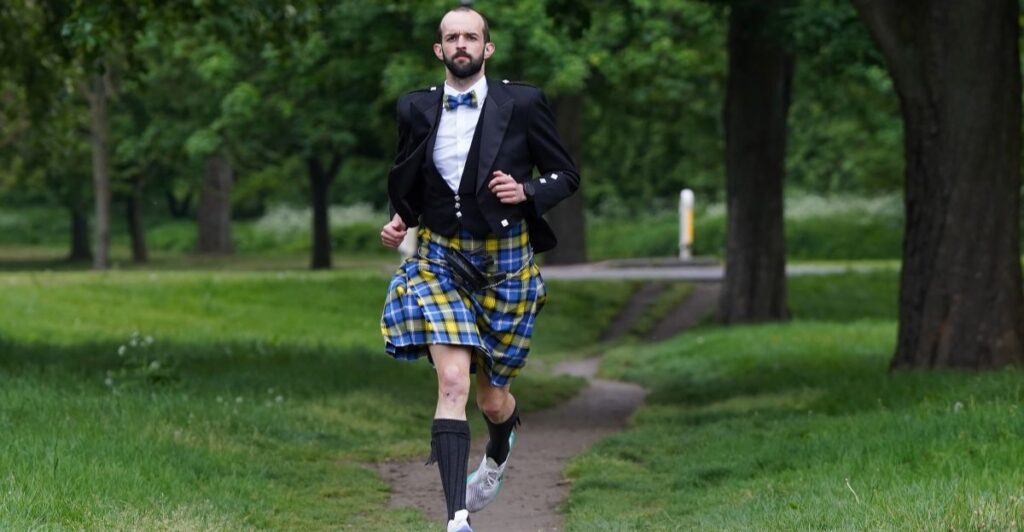 Stephen Molloy broke the world record for running a marathon in full Highland dress for the My Name'5 Doddie Foundation. Credit: Stewart Atwood.