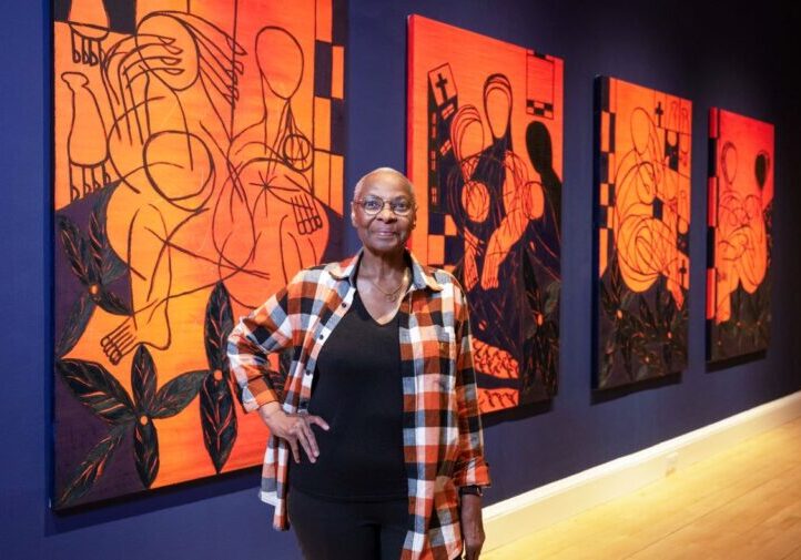 The artist, Everlyn Nicodemus, with works from her new series, Lazarus Jacaranda (2022–24), created for the exhibition. Credit: Neil Hanna