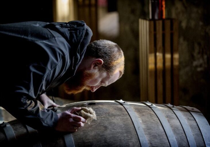 Speyside Tour with SMWS 2 &amp; 3rd Nov 2017.
Glen Moray Distillery, Elgin
Euan Campbell smells the whisky in the barrels

photo/Peter Sandground