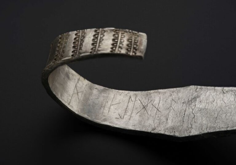 Galloway Hoard arm ring with runic inscription in view © National Museums Scotland