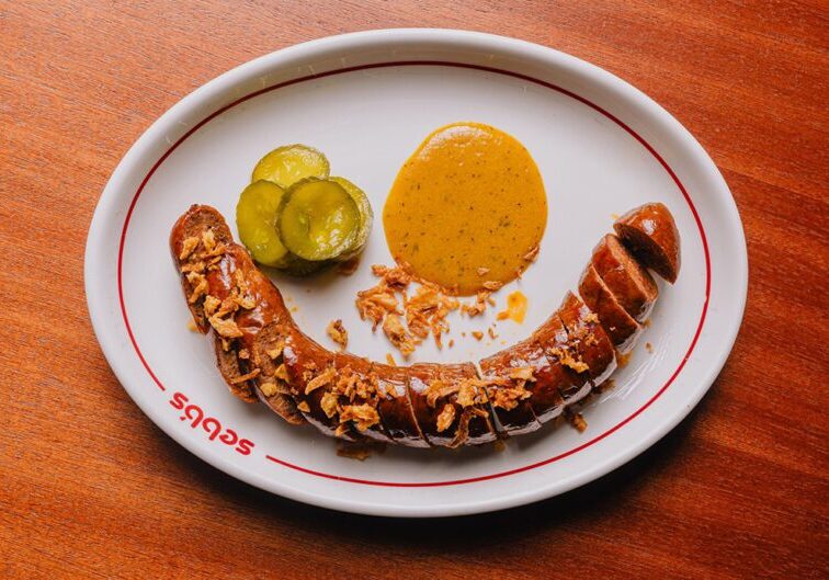 Sebb's_DC's Texan hotlink, yellow barbeque sauce and bread and butter pickles_ Credit_ Connor Stewart