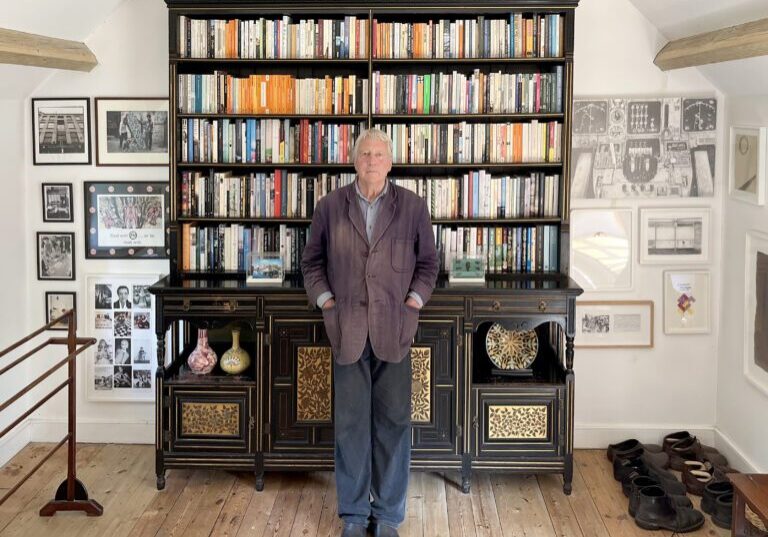 Jeremy Cooper in front of a bookcase in the bedroom of his cottage in Somerset. Credit: Jeremy Cooper 